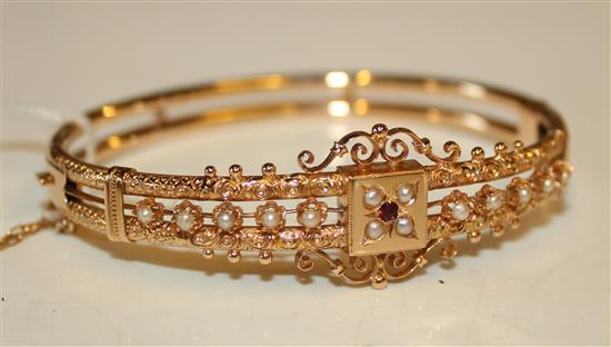 Victorian style gold hinged bangle with seed pearls and garnet